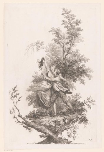 Man and woman in embrace with a hat full of grapes