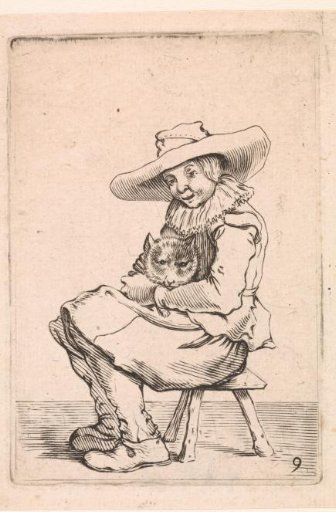 Seated boy with a cat on his lap