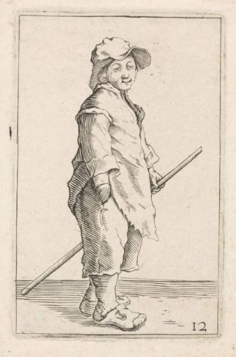 Standing young man with a staff