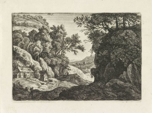 Two buildings at the foot of a mountain