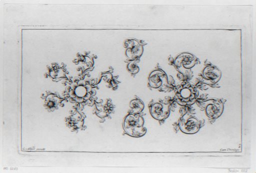 Two large and two small motifs consisting of leaf scrolls and flowers