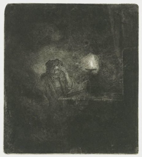 Student at a table by candlelight