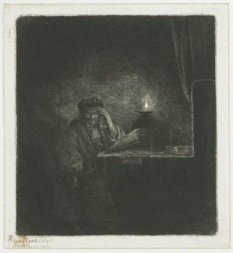 Student at a table by candlelight