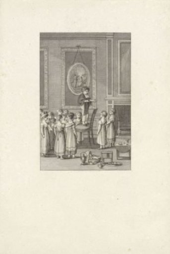 Boy on a chair surrounded by girls