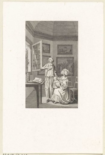Reinhart and his wife with their baby before a window