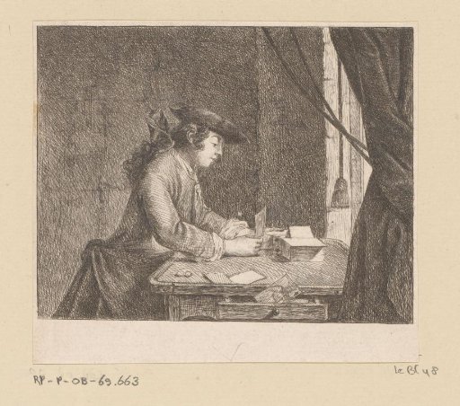 Young Man Building a House of Cards at a Table