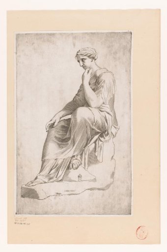 Statue of a woman seated on a rock