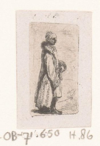 Standing man in long fur coat