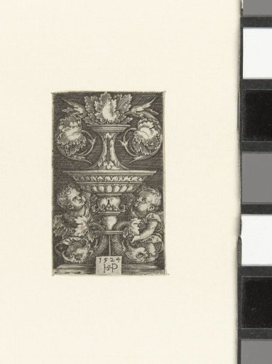 Vase with Leaf Scrolls Resting on Two Dolphins