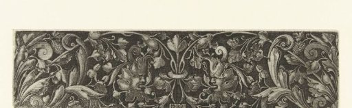 Two volutes of leaf scrolls, ending in a mask