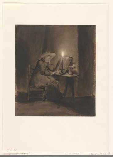 Boy reading by candlelight