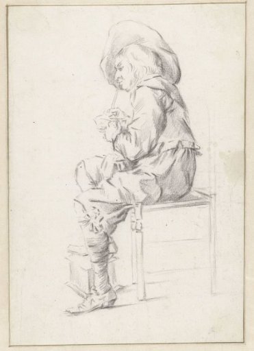 Sitting young man lighting his pipe
