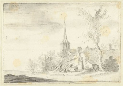 Village view, in the middle a church tower with a high spire