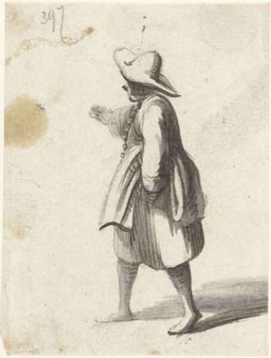 Pointing young man with a broad-brimmed hat