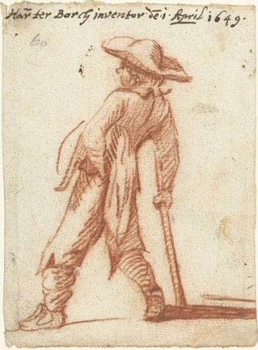 Boy leaning on a staff