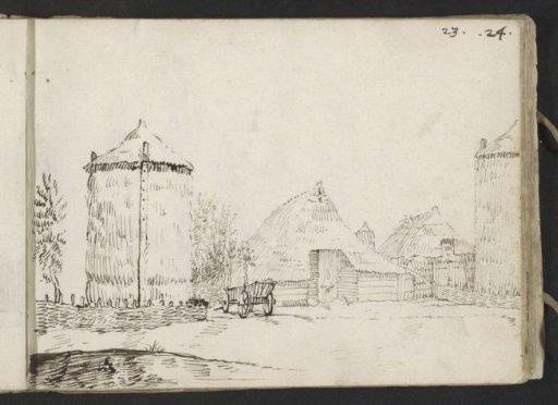 Farmyard with two barns and haystacks