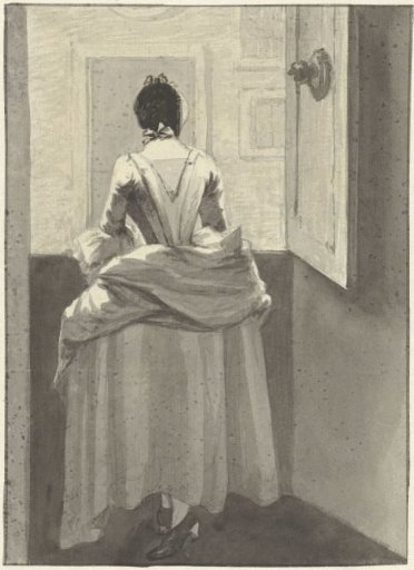 Woman standing before a door
