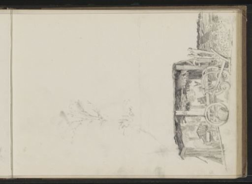 Plough in front of a barn