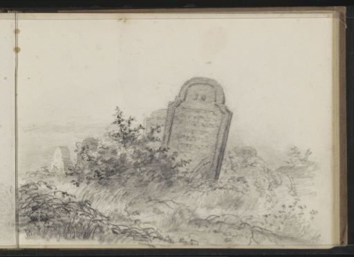 Gravestones along a path in a landscape