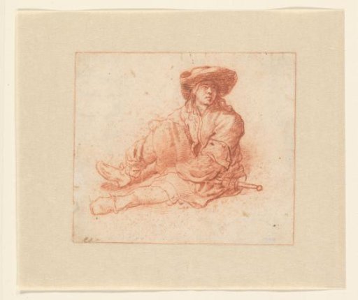 Young man, sitting on the ground