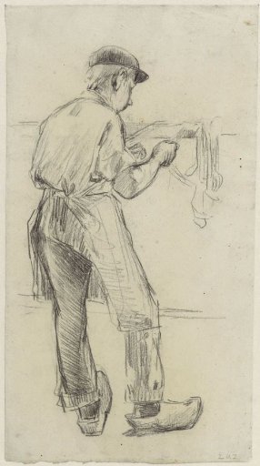 Factory boy at work, seen from the back