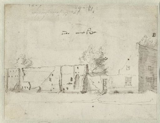 Ruin of a wall behind a house