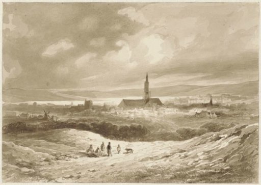 View from the hills of a town on a lake