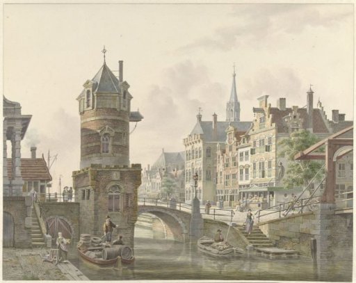 Canal in a town with a small tower near a stone bridge