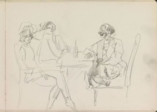 Two women and a man at a table
