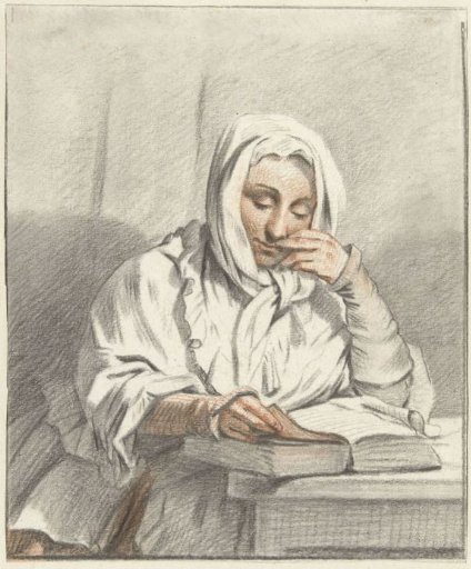 Reading young woman at a table