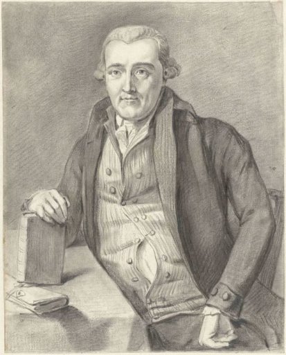 Portrait of a man seated at a table