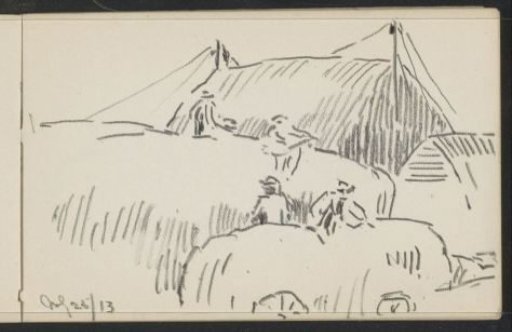 Workers on hay wagons at a barn