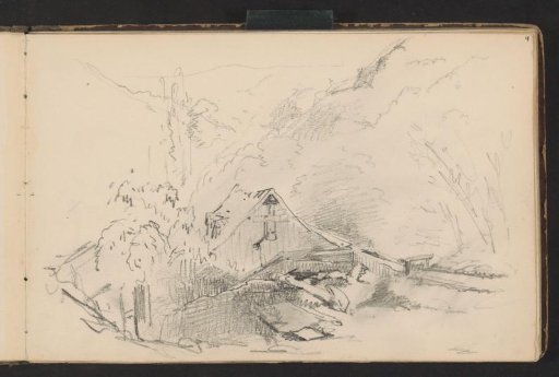 Wooden house at the foot of a mountain