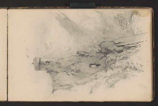 Mountain landscape with a stone tower next to a valley