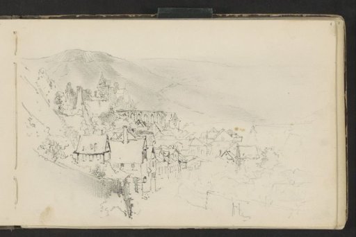 View of a town at the foot of a mountain