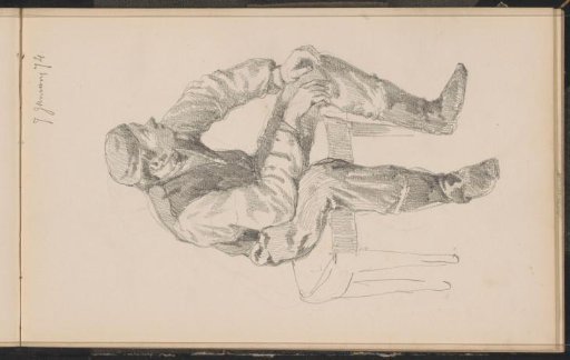 Seated man with a cap