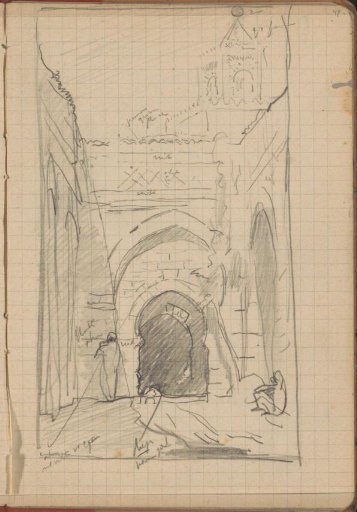 Street with a gate and in the background the minaret of the Al-Zaytuna Mosque