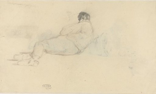 Lying boy, seen from behind