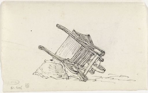 Wheelbarrow, lying against a stone
