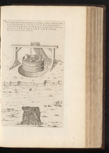 Men digging a water well and hoisting debris