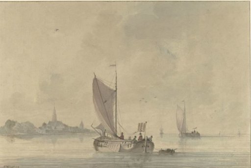 Sailing barges on the water before a Dutch town