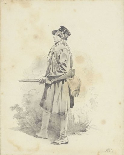 Standing man with a hunting rifle