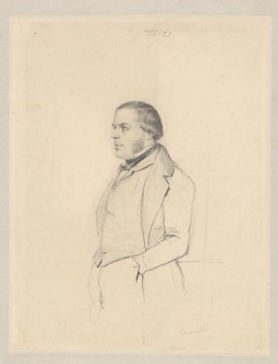 Portrait of a standing man, hands in pockets, seen in profile