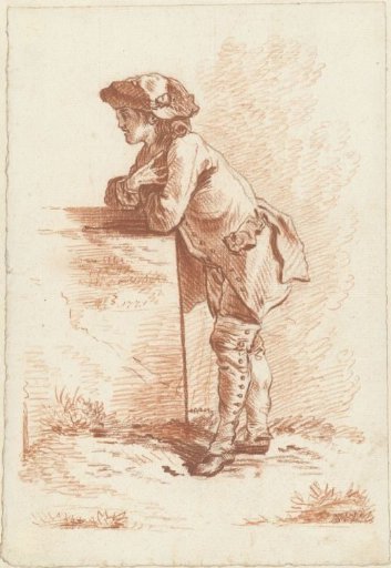 Young man leaning on a stone