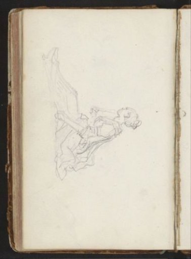 Seated woman on the ground with a fan