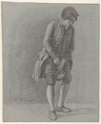 Young man drawing the cork from a bottle