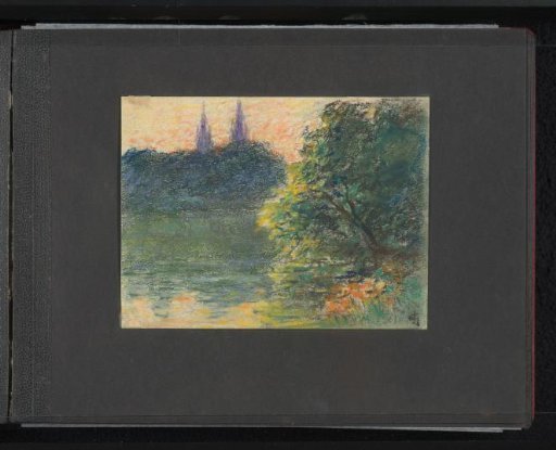 View of water and vegetation with two towers in the distance
