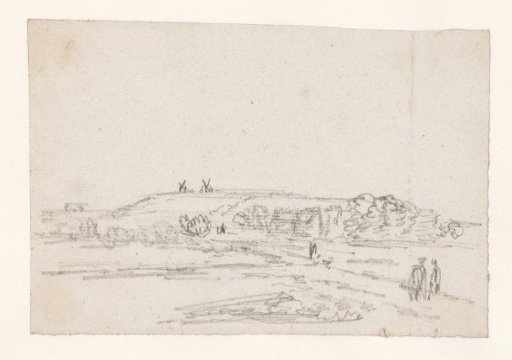 View of a hill with two windmills