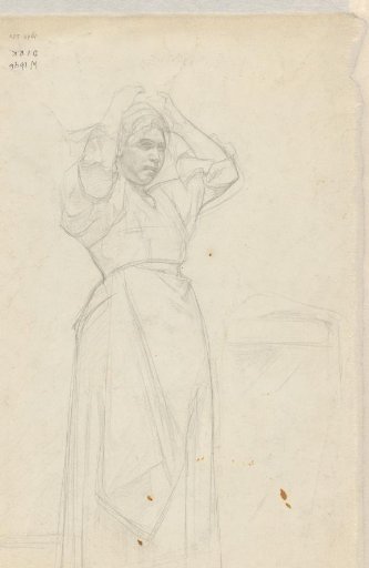 Standing woman arranging her hair