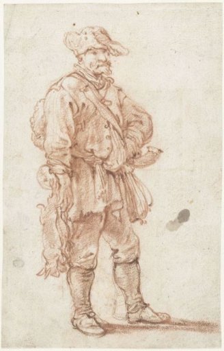 Standing hunter with two dead hares